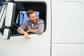 Close up of truck driver behind steering wheel. Copy space. Royalty Free Stock Photo