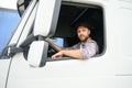 Close up of truck driver behind steering wheel. Copy space. Royalty Free Stock Photo