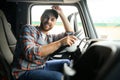 Close up of truck driver behind steering wheel. Copy space. Royalty Free Stock Photo