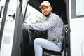 Close up of truck driver behind steering wheel. Copy space Royalty Free Stock Photo