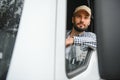 Close up of truck driver behind steering wheel. Copy space Royalty Free Stock Photo