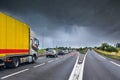 close-up truck driving on a highway in the storm