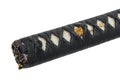 Close-up Tsuka : handle of Japanese sword wrapped by black silk cord with gold fitting isolated in white background.