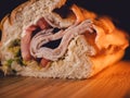 close up of turkey sandwich on bamboo cutting board Royalty Free Stock Photo