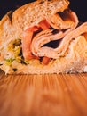 close up of turkey sandwich on bamboo cutting board Royalty Free Stock Photo