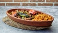 Turkish chicken Kebab called Mudurnu Kebab, garnished with vegetables, bulgur pilaf served on ceramic dish - Turkish,  Food Kebab Royalty Free Stock Photo