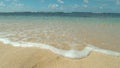 CLOSE UP: Turquoise waves roll in on the peaceful shore on tropical island.