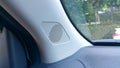 Close-up of a tweeter speaker in a car