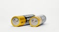 Close-up of two AA batteries, isolated on white background Royalty Free Stock Photo