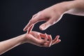 Close-up two beautiful hands of a man and a woman in a gentle gesture of touch. The concept of tenderness of touch and Royalty Free Stock Photo