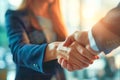 Close-up of two business persons engaged in a handshake, symbolizing a professional agreement or greeting Royalty Free Stock Photo