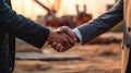 Close-up of two businessmen shaking hands on the background of a construction site. Generative AI. Royalty Free Stock Photo