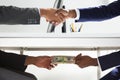 Two Businesspeople Shaking Hand And Taking Bribe Royalty Free Stock Photo