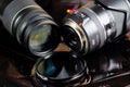 Close up of two camera lenses with isolated circular filter on negative film strips