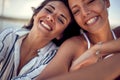 Close-up of two cheerful female models who is posing for a photo on a yacht. Summer, sea, vacation, friendship Royalty Free Stock Photo