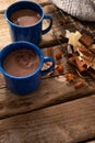 Close-up. Two cups of coffee, chocolate chips, star anise and cinnamon sticks on a plain wooden table. Restaurant, hotel, cafe, Royalty Free Stock Photo