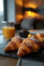 Close-up of two delicious croissants sitting on a table surface. The concept of breakfast. Royalty Free Stock Photo