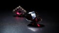 a close up of two diamonds on a black surface with a black background Royalty Free Stock Photo