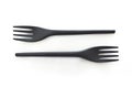 Close up of two disposable black plastic forks on white background. Horizontal view. Save earth concept Royalty Free Stock Photo