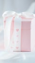 Close-up of two elegant pink gift boxes tied with heart-patterned ribbons, ready for celebrations Royalty Free Stock Photo