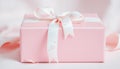 Close-up of two elegant pink gift boxes tied with heart-patterned ribbons, ready for celebrations Royalty Free Stock Photo