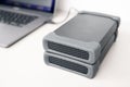 Close up of External hard drives storage connected to a modern laptop computer