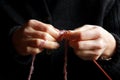 Selective focus on knitting hands Royalty Free Stock Photo