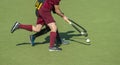 Close up of two field hockey players, challenging eachother for the control and posession of the ball during an intense, Royalty Free Stock Photo