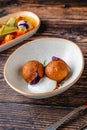 Close-up of two fried croquettes served with creamy dip Royalty Free Stock Photo