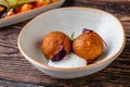Close-up of two fried croquettes served with creamy dip Royalty Free Stock Photo
