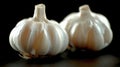 Two Garlic Bulbs on Table Royalty Free Stock Photo