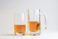 Two glasses of beer on white background Royalty Free Stock Photo