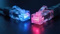Close-up of two glowing ethernet connectors, one blue, one pink, on a dark surface. Network data cables link for digital Royalty Free Stock Photo
