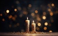 Close up of two golden burning candles on the wooden table with sparkling glitter. Blurred Christmas light background