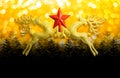 Two golden reindeer with red star on circular bokeh yellow gold background and copy space, concept christmas day. Royalty Free Stock Photo