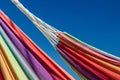 Close-up of two hammocks against the blue sky