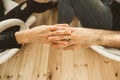 Close-up of two hands fondly joined together. Concept of love between couple Royalty Free Stock Photo