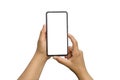 Close-up of two hands holding mobile phones, white screen separated on white background Royalty Free Stock Photo
