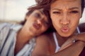 Close-up of two handsome female models who is making grimaces and posing for a photo on a yacht. Summer, sea, vacation, friendship Royalty Free Stock Photo