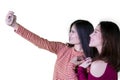 Two happy women take a selfie photo on studio Royalty Free Stock Photo
