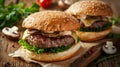 Close-up of two homemade juicy burgers with mushrooms on a wooden cutting board