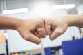 Close-up of two human hands clashing shows the friendship of colleagues