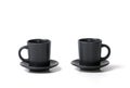 Close-up of two identical coffee tea cups with a saucer on a white background Royalty Free Stock Photo