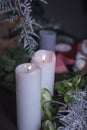 Close-up of two large white candles burning on a dark background, selective focus Royalty Free Stock Photo