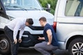 Two Men Inspecting The Car Damaged After Accident Royalty Free Stock Photo