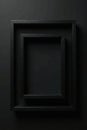 Close up of two nested black frames against a black background, dark, abstract, texture