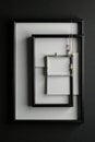 Close up of two nested black frames against a black background, home, backdrop