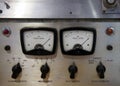 Close up of two old decibel meters on an old vintage reel to reel tape recorder with control knobs and switches Royalty Free Stock Photo