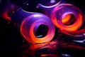 a close up of two orange and purple swirls on a black background