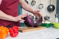 Close up of two part of red cabbage on table. Cook hold of two parts of red cabbage. Closeup of two parts of cabbage Royalty Free Stock Photo